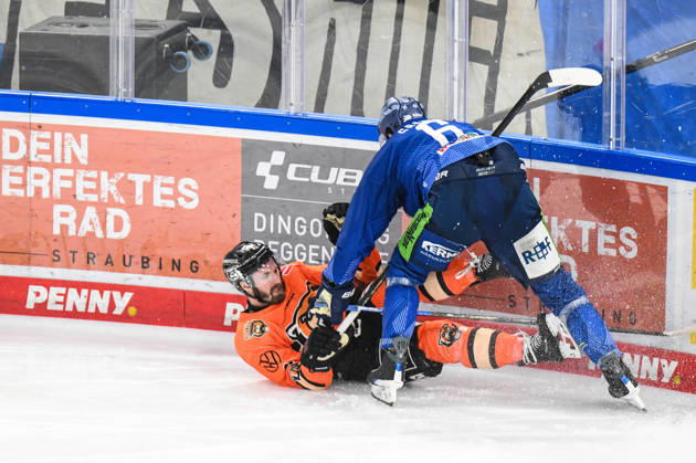 Straubing Tigers vs Grizzlys Wolfsburg, Ice Hockey, German Ice Hockey League, Penny DEL, 46 Matchday, Season 2025 2026, 27 02 2026 Alex Green Straubing Tigers pushes Jimmy Lambert Grizzlys Wolfsburg to the ground, Ice Hockey Men, German Ice Hockey League, Penny DEL, 46 Matchday, Season 2025 2026 on 27 02 2026 at the Eisstadion am Pulverturm, Straubing Tigers blue vs Grizzlys Wolfsburg orange