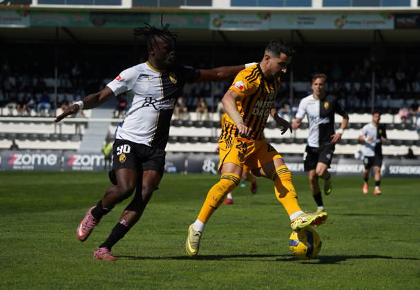 Liga Portugal 2 Meu Super Round 24 football match between SC Farense and Lusitania Lourosa FC, Faro, Portugal Faro, Portugal. 1 st Mar, 2026. Tiago Cerveira of Lourosa FC, trygint to control the ball with the opposition of Bala Sangare, SC Farense player, during the SC Farense 2 - 1 Lusitano Lourosa FC Round 24 match for the football Liga Portugal 2 Meu Super. Nuno Pires Veloso Alamy Live News Copyright: xNunoxPiresxVelosox