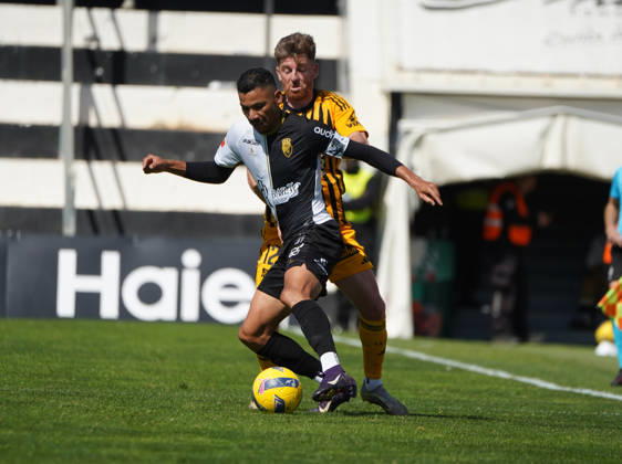 Liga Portugal 2 Meu Super Round 24 football match between SC Farense and Lusitania Lourosa FC, Faro, Portugal Faro, Portugal. 1 st Mar, 2026. Claudio Falcao of SC Farense trying to get pass Arsenio Nunes of Lourosa FC, during the SC Farense 2 - 1 Lusitano Lourosa FC Round 24 match for the football Liga Portugal 2 Meu Super. Nuno Pires Veloso Alamy Live News Copyright: xNunoxPiresxVelosox