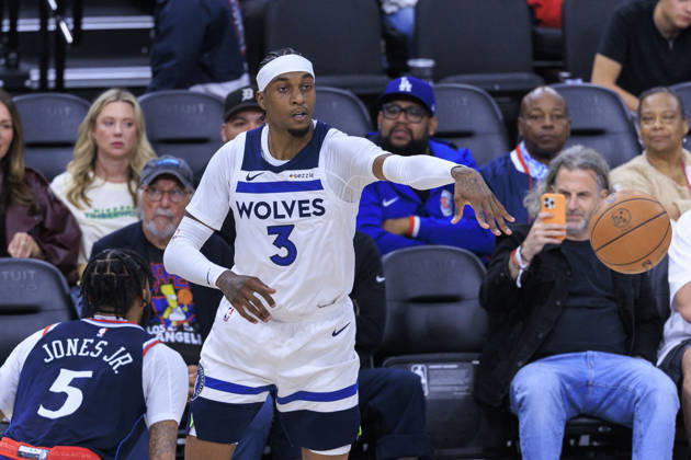March 11, 2026, Inglewood, California, USA: Jaden McDaniels 3 of the Minnesota Timberwolves passes the ball as Derrick Jones Jr. 5 of the Los Angeles Clippers guards during their regular season NBA, Basketball Herren, USA game on Wednesday March 11, 2026 at Intuit Dome in Inglewood, California. Clippers defeat Timberwolves, 153-128. ARIANA RUIZ PI Clippers Vs. Timberwolves - ZUMAp124 20260311_zaa_p124_124 Copyright: xArianaxRuizx