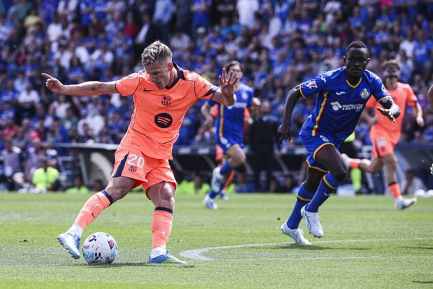 25 April 2026; Estadio Coliseum, Madrid, Spain; La Liga Football, Getafe CF versus FC Barcelona, Barca Daniel Olmo is defended by Djene Dakonam Getafe vs FC Barcelona 900 Cordon Press 900 CordonxPress LOF - Getafe vs FC Barcelona