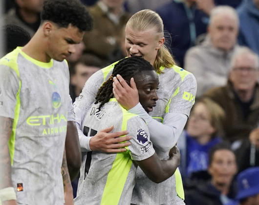 Liverpool, England, 4th May 2026. Erling Haaland of Manchester City hugs goalscorer Jeremy Doku of Manchester City during the Everton vs Manchester City Premier League match at Hill Dickinson Stadium, Liverpool. Picture credit should read: Andrew Yates Sportimage EDITORIAL USE ONLY. No use with unauthorised audio, video, data, fixture lists, club league logos or live services. Online in-match use limited to 120 images, no video emulation. No use in betting, games or single club league player publications. SPI_022_AY_Everton_Man_City SPI-4779-0022