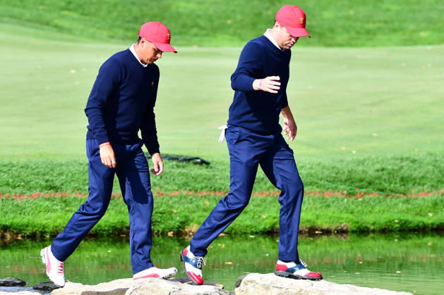September 30, 2017 - Jersey City, New Jersey, U.S - Rickie Fowler of the US Team(left)j and Justin Thomas of the US Team(right) walk across the stone bridge after the 12th hole during Saturday matches of the Presidents Cup at Liberty National Golf Club in Jersey City, NJ Copyright: xBrianxCianciox