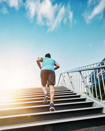 Back, fitness and running with man, stairs and exercise with progress, sunshine and challenge. Rear view, steps and runner in city, lens flare or training for wellness, healthy or energy with workout. (License=RF) 21848710 ,model released, Symbolfoto Copyright: xZoonar.com KasperxRavlox 21848710 ,model released, Symbolfoto ,property released
