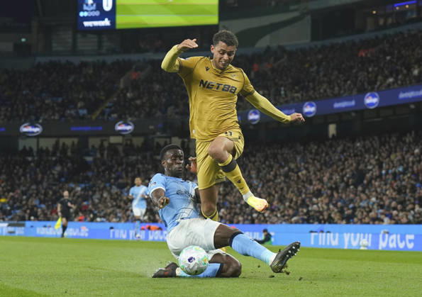 Manchester, England, 13th May 2026. Marc Guehi of Manchester City tackles Brennan Johnson of Crystal Palace during the Manchester City vs Crystal Palace Premier League match at the Etihad Stadium, Manchester. Picture credit should read: Andrew Yates Sportimage EDITORIAL USE ONLY. No use with unauthorised audio, video, data, fixture lists, club league logos or live services. Online in-match use limited to 120 images, no video emulation. No use in betting, games or single club league player publications. SPI_053_AY_Man_City_Palace SPI-4799-0051