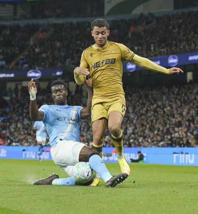 Manchester, England, 13th May 2026. Marc Guehi of Manchester City tackles Brennan Johnson of Crystal Palace during the Manchester City vs Crystal Palace Premier League match at the Etihad Stadium, Manchester. Picture credit should read: Andrew Yates Sportimage EDITORIAL USE ONLY. No use with unauthorised audio, video, data, fixture lists, club league logos or live services. Online in-match use limited to 120 images, no video emulation. No use in betting, games or single club league player publications. SPI_054_AY_Man_City_Palace SPI-4799-0052