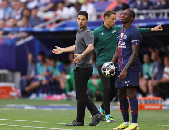 Budapest, Hungary, 30th May 2026. Mikel Arteta manager of Arsenal looks at Nuno Mendes of Paris St Germain as he waits to take a throw in during the Paris Saint Germain vs Arsenal UEFA Champions League Final match at Puskas Arena, Budapest. Picture credit should read: David Klein Sportimage EDITORIAL USE ONLY. No use with unauthorised audio, video, data, fixture lists, club league logos or live services. Online in-match use limited to 120 images, no video emulation. No use in betting, games or single club league player publications. SPI_094_DK_PSG_Arsenal SPI-4828-0093