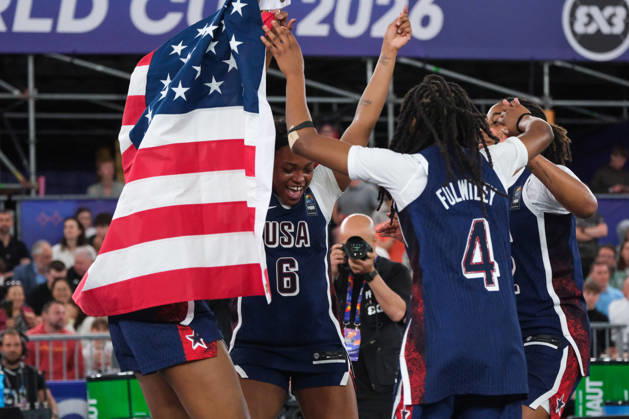 June 7, 2026, Warsaw, Masovian Voivodeship, Poland: USA s MILAYSIA FULWILEY (4), MIKAYLAH WILLIAMS (12), SAHARA WILLIAMS (6), and JOYCE EDWARDS (13) dance with an American flag in celebration of victory at the end of the FIBA 3x3 Basketball World Cup women s final game between Australia and USA in Warsaw, Poland. Team USA defeated Australia to become women s world champions. Warsaw Poland - ZUMAk204 20260607_zip_k204_030 Copyright: xRomanxKozielx
