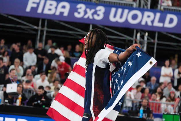 June 7, 2026, Warsaw, Masovian Voivodeship, Poland: USA s MILAYSIA FULWILEY (4) celebrates victory with an American flag at the end of the FIBA 3x3 Basketball World Cup women s final game between Australia and USA in Warsaw, Poland. Team USA defeated Australia to become women s world champions. Warsaw Poland - ZUMAk204 20260607_zip_k204_027 Copyright: xRomanxKozielx