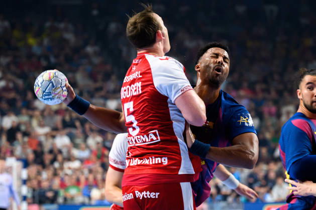 Cologne, Germany Handball EHF CL Final 4 semi-final Aalborg Handbold Barca v li in duel Sander Sagosen Aalborg and Timothey N guessan Barcelona Cologne Lanxess Arena Nordrhein Westfalen Germany