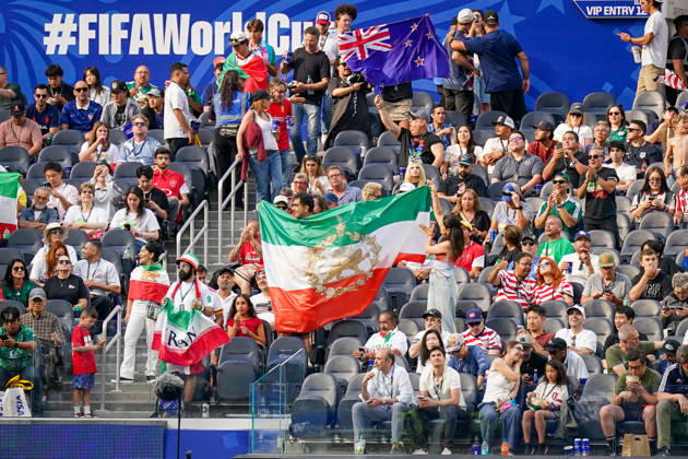 USA Soccer 2026 FIFA World Cup Group Stage Group G Iran vs. New Zealand SoFi Stadium, Inglewood, Los Angeles County, California Iranian fans watch the World Cup match from the stands and display various flags, including the historic Iranian Lion and Sun flag, which is considered a symbol of opposition to the Islamic Republic. The motif represents fan culture, Iranians in exile, political identity, and solidarity in the context of the 2026 FIFA World Cup,detected_source_language Copyright: xJOERANxSTEINSIEKx