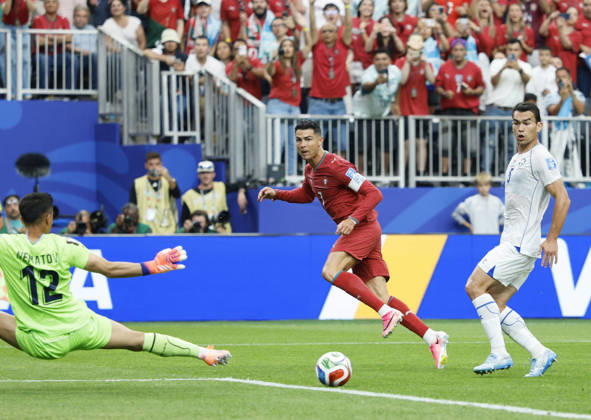 Football: 2026 World Cup Portugal s Cristiano Ronaldo (C) scores the second of his two goals in the first half of a World Cup Group K football match against Uzbekistan at Houston Stadium in Houston on June 23, 2026.  A14AA0005620003P