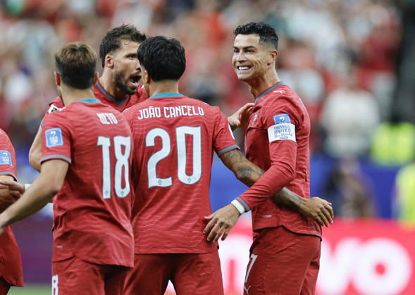 Football: 2026 World Cup Portugal s Cristiano Ronaldo (R) celebrates with teammates after scoring the opening goal in the first half of a World Cup Group K football match against Uzbekistan at Houston Stadium in Houston on June 23, 2026.  A14AA0005620006P