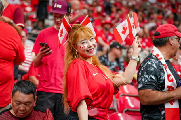 Canada Soccer 2026 FIFA World Cup Group Stage: Switzerland vs. Canada at BC Place Stadium in Vancouver, British Columbia; Canadian soccer fans, Fan portrait, female fan, Canadian flags, Canadian national flag, face paint, fan merchandise, fan culture, soccer enthusiasm, spectators, bleachers, stadium atmosphere, red and white clothing, supporters, fans, emotions, smiles, celebratory mood, public viewing atmosphere, sporting event, international audience, World Cup atmosphere, soccer fans, close-up, portrait, Canadian female supporter, fan section, sports, leisure, event, crowd Copyright: xJOERANxSTEINSIEKx