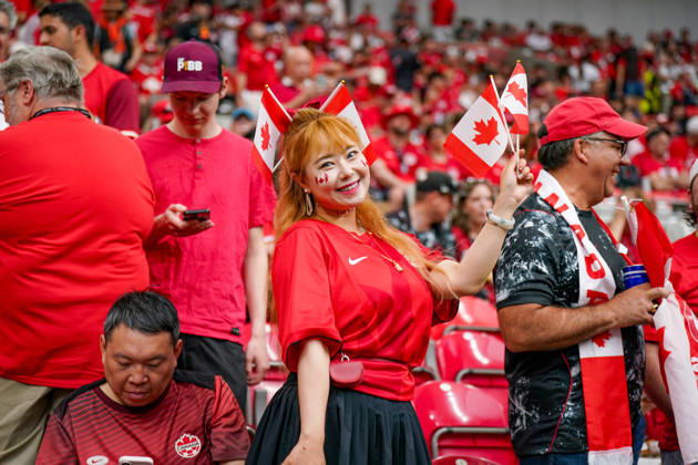 Canada Soccer 2026 FIFA World Cup Group Stage: Switzerland vs. Canada at BC Place Stadium in Vancouver, British Columbia; Canadian soccer fans, Fan portrait, female fan, Canadian flags, Canadian national flag, face paint, fan merchandise, fan culture, soccer enthusiasm, spectators, bleachers, stadium atmosphere, red and white clothing, supporters, fans, emotions, smiles, celebratory mood, public viewing atmosphere, sporting event, international audience, World Cup atmosphere, soccer fans, close-up, portrait, Canadian female supporter, fan section, sports, leisure, event, crowd Copyright: xJOERANxSTEINSIEKx