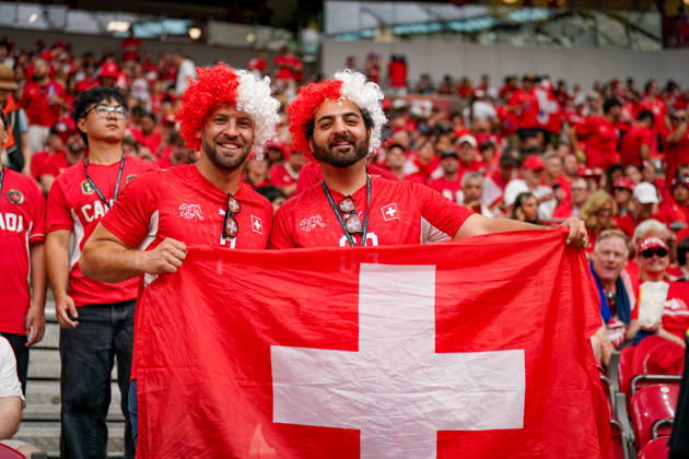 Canada Soccer 2026 FIFA World Cup Group Stage Switzerland vs. Canada BC Place Stadium Vancouver, British Columbia Swiss soccer fans, supporters, fan portrait, two supporters with a Swiss flag, Swiss national flag, red and white wigs, SFV jersey, Swiss Football Association, facial expression, smile, fan culture, soccer enthusiasm, spectators, stands, stadium atmosphere, fan section, supporters, cheering, international fans, group photo, portrait, flag, national pride, sporting event, World Cup atmosphere, audience, leisure, crowd, Switzerland, soccer, emotions, red fan apparel Copyright: xJOERANxSTEINSIEKx