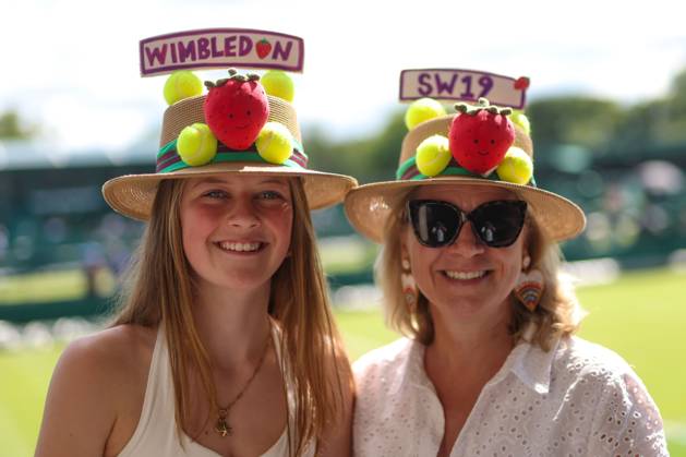 Attendees wear strawberry tennis hats ahead of Day 3 Wimbledon Tennis Championships, Day 3, The All England Lawn Tennis and Croquet Club, London, UK - 01 Jul 2026London The All England Lawn Tennis and United Kingdom  Copyright: xKieranxMcManus Shutterstockx 16970334a
