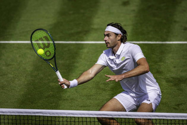 RECORD DATE NOT STATED 3rd July 2026; All England Lawn Tennis and Croquet Club, London, England; Wimbledon Tennis Tournament, Day Five; Patrik Trhac (USA) plays a volley in his second round match with Mac Kiger (USA) against Harri Heliovaara (FIN) and Henry Patten (GBR) GodfreyxPitt