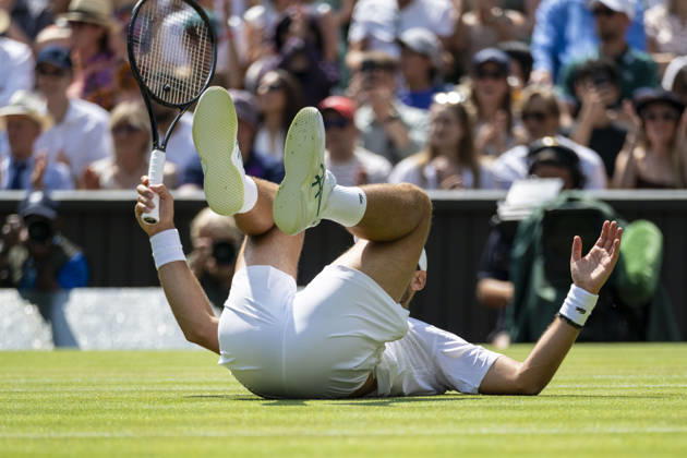 (260704) -- LONDON, July 4, 2026 -- Novak Djokovic of Serbia falls during the men s singles third round match against Arthur Rinderknech of France at the Wimbledon Tennis Championships in London, Britain, on July 3, 2026. (Photo by Xinhua) (SP)BRITAIN-LONDON-TENNIS-WIMBLEDON-MEN S SINGLES StephenxChung 