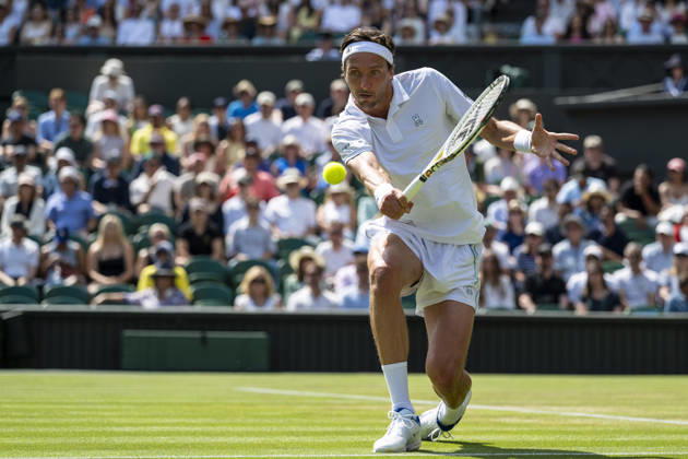 (260704) -- LONDON, July 4, 2026 -- Arthur Rinderknech of France returns the ball during the men s singles third round match against Novak Djokovic of Serbia at the Wimbledon Tennis Championships in London, Britain, on July 3, 2026. (Photo by Xinhua) (SP)BRITAIN-LONDON-TENNIS-WIMBLEDON-MEN S SINGLES StephenxChung 
