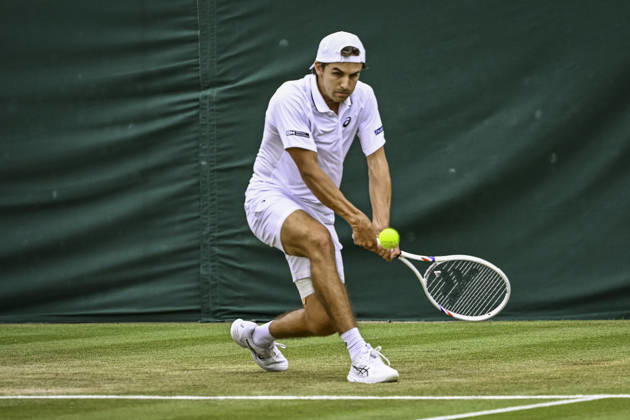 RECORD DATE NOT STATED 4th July 2026; All England Lawn Tennis and Croquet Club, London, England; Wimbledon Tennis Tournament, Day Six; Zachary Svajda (USA) plays a backhand in his third round match against Alex De Minaur (AUS) GodfreyxPitt