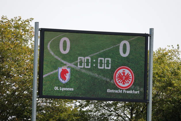 Herzogenaurach, Germany, August 16, 2026 Friendly Match: Olympique Lyon Women vs. Eintracht Frankfurt Women. Pictured: Stock photo of a sign featuring the logos of both Olympique Lyon and Eintracht Frankfurt. Copyright: HMBxMedia MadeleinexFantini