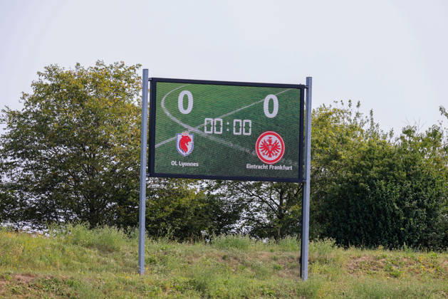 Herzogenaurach, Germany, August 16, 2026 Friendly Match: Olympique Lyon Women vs. Eintracht Frankfurt Women. Pictured: Stock photo of a sign featuring the logos of both Olympique Lyon and Eintracht Frankfurt. Copyright: HMBxMedia MadeleinexFantini