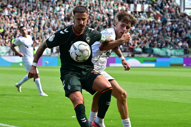 August 22, 2026, German Soccer, Men, DFB Cup, 1st Round, 2026–2027 Season, Hamburg, Lüneburger SK vs. Werder Bremen: Marco Friedl (Werder, 32) tries to get past Tjark Dörr (Lüneburg, 20). DFB and DFL regulations prohibit any use of photographs as image sequences and or quasi-video. Hamburg Millerntorstadion, Hamburg, Germany Copyright: xnordphotoxGmbH xWitkex