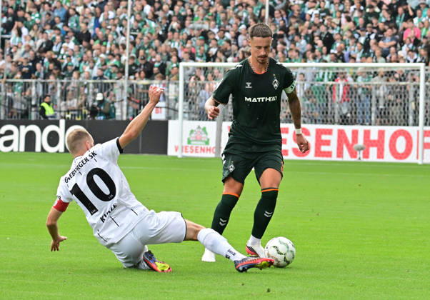 August 22, 2026, German Soccer, Men s, DFB Cup, 1st Round, 2026–2027 Season, Hamburg, Lüneburger SK vs. Werder Bremen: Marco Friedl (Werder, No. 32) tries to get past Marian Kunze (Lüneburg, No. 10). DFB and DFL regulations prohibit any use of photographs as image sequences and or quasi-video. Hamburg Millerntorstadion, Hamburg, Germany Copyright: xnordphotoxGmbH xWitkex