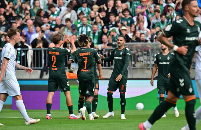 August 22, 2026, German Soccer, Men, DFB Cup, 1st Round, 2026–2027 Season, Hamburg, Lüneburger SK vs. Werder Bremen: Jens Stage of Werder 06 scores the 1–0 goal for Bremen past goalkeeper Tommy Henze of Pauli 01 and celebrates with the team. DFB and DFL regulations prohibit any use of photographs as image sequences and or quasi-video. Hamburg Millerntorstadion, Hamburg, Germany Copyright: xnordphotoxGmbH xWitkex