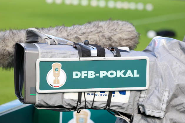 DFB Cup logo on a camera, stock photo, illustrative image, themed photo, themed image, GER, TSV 1860 Munich vs. Holstein Kiel, soccer, DFB Cup, 1st round, 2026–2027 season, August 22, 2026, DFL regulations prohibit any use of photographs as image sequences, GER, TSV 1860 Munich vs. Holstein Kiel, soccer, DFB Cup, 1st round, 2026–2027 season, August 22, 2026, Munich Copyright: xEibner-Pressefoto JennixMaulx EP_JML