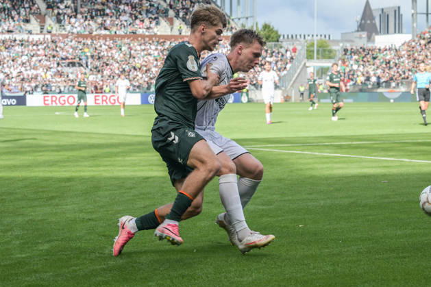 Mick Schmetgen of SV Werder Bremen, age 33, in a tackle; Lüneburger SK vs. Hansa SV Werder Bremen; soccer; DFB Cup; DFB; August 22, 2026. DFB regulations prohibit any use of photographs as image sequences and or quasi-video. Hamburg, Hamburg, Germany Copyright: xkolbert-press BurghardxSchreyerx