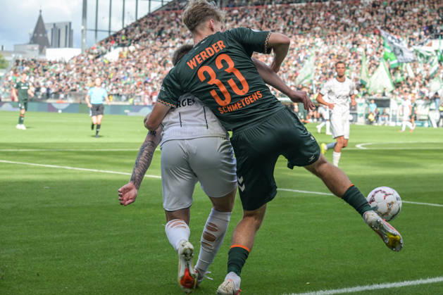 Mick Schmetgen of SV Werder Bremen, age 33, in a tackle; Lüneburger SK vs. Hansa SV Werder Bremen; soccer; DFB Cup; DFB; August 22, 2026. DFB regulations prohibit any use of photographs as image sequences and or quasi-video. Hamburg, Hamburg, Germany Copyright: xkolbert-press BurghardxSchreyerx