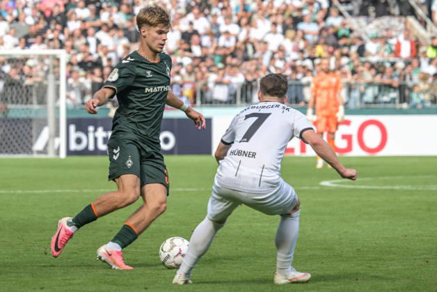 Mick Schmetgen of SV Werder Bremen, age 33, in a tackle; Lueneburger SK vs. Hansa SV Werder Bremen; soccer; DFB Cup; DFB; August 22, 2026. DFB regulations prohibit any use of photographs as image sequences and or quasi-video. Hamburg, Hamburg, Germany Copyright: xkolbert-press BurghardxSchreyerx