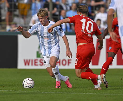 August 22, 2026, Soccer, 2026–27 DFB Cup, First Round, TSV 1860 Munich vs. Holstein Kiel, at the Stadion an der Grünwalderstrasse in Munich, from left: Fabio Wagner (TSV 1860 Munich) vs. Jonas Therkelsen (Holstein Kiel)