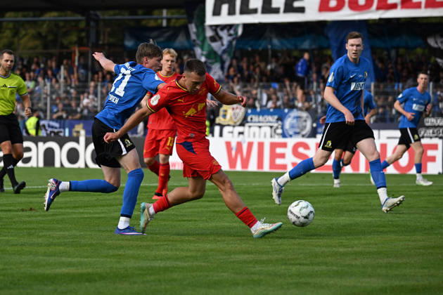 August 22, 2026, xjhx, Soccer, DFB Cup First Round, Eintracht Trier vs. RB Leipzig, Elia Dittrich, SV Eintracht Trier 05, Brajan Gruda, RB Leipzig, tackle, action, battle for the ball, Trier