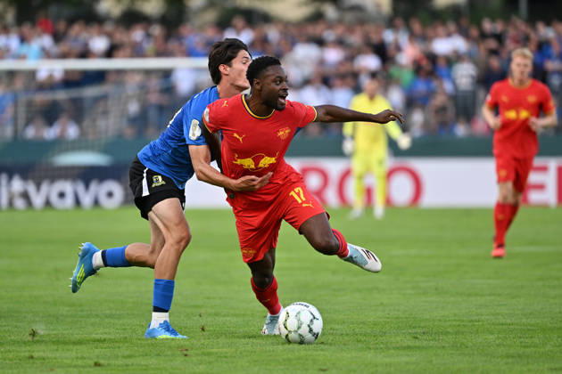 August 22, 2026, xjhx, Soccer, DFB Cup First Round, Eintracht Trier vs. RB Leipzig, Gianluca Pelzer, SV Eintracht Trier 05, Ridle Baku, RB Leipzig, tackle, action, battle for the ball, Trier