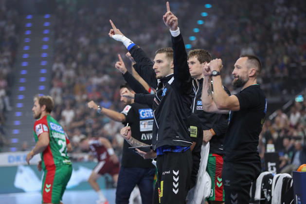 August 22, 2026, xgox, Handball, 2026 Rexel Supercup, SC Magdeburg vs. Füchse Berlin, from left: Dominik Kuzmanovic (Magdeburg), celebrating a saved shot, blocked, saved, Munich goalkeeper