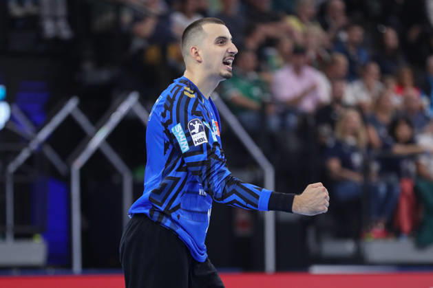 August 22, 2026, xgox, Handball, 2026 Rexel Super Cup, SC Magdeburg vs. Füchse Berlin, from left: Matej Mandic (Magdeburg), 12 celebrating a saved shot, blocked, saved, Munich goalkeeper