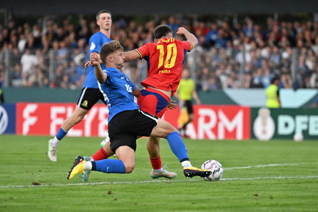 August 22, 2026, xjhx, Soccer, DFB Cup First Round, Eintracht Trier vs. RB Leipzig, Matheo Kritzer, SV Eintracht Trier 05, Brajan Gruda, RB Leipzig, tackle, action, battle for the ball, Trier