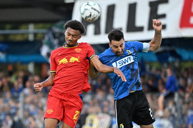 August 22, 2026, xjhx, Soccer, DFB Cup, First Round, Eintracht Trier vs. RB Leipzig, Tidiam Gomis (RB Leipzig) vs. Christopher Spang (SV Eintracht Trier 05), tackle, action, battle for the ball, Trier