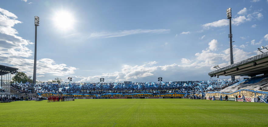The Löwen fans performed a choreographed display celebrating 60 years since the German championship; the banners at the bottom are inscribed with the names of the players from the championship team GER, TSV 1860 Munich vs. Holstein Kiel, soccer, DFB Cup, 1st round, 2026–2027 season, August 22, 2026 DFL DFB REGULATIONS PROHIBIT ANY USE OF PHOTOGRAPHS as IMAGE SEQUENCES and or QUASI-VIDEO Photo: HMB Media, Heike Feiner Copyright: HMBxMedia HeikexFeiner