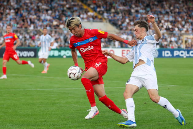 Tackle between Hiroki Sekine of Holstein Kiel, 32, and Emre Erdogan of TSV 1860 Munich, 19, GER, TSV 1860 Munich vs. Holstein Kiel, soccer, DFB Cup, 1st round, 2026–2027 season, August 22, 2026, DFL regulations prohibit any use of photographs as image sequences, GER, TSV 1860 Munich vs. Holstein Kiel, soccer, DFB Cup, 1st round, 2026–2027 season, August 22, 2026, Munich Copyright: xEibner-Pressefoto JennixMaulx EP_JML