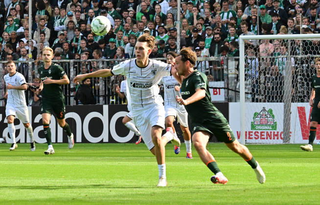 August 22, 2026, German Soccer, Men s, DFB Cup, 1st Round, 2026–2027 Season, Hamburg, Lüneburger SK vs. Werder Bremen: Tjark Dörr (Lüneburg 20) tries to get past Olivier Deman (Werder 02). DFB and DFL regulations prohibit any use of photographs as image sequences and or quasi-video. Hamburg Millerntorstadion, Hamburg, Germany Copyright: xnordphotoxGmbH xWitkex