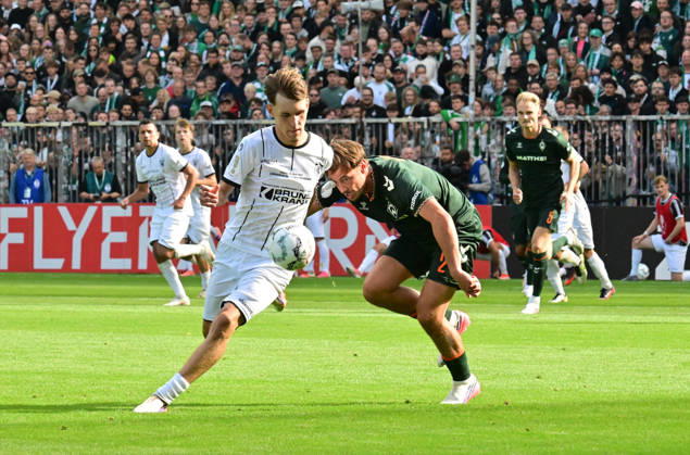 August 22, 2026, German Soccer, Men s, DFB Cup, 1st Round, 2026–2027 Season, Hamburg, Lüneburger SK vs. Werder Bremen: Tjark Dörr (Lüneburg 20) tries to get past Olivier Deman (Werder 02). DFB and DFL regulations prohibit any use of photographs as image sequences and or quasi-video. Hamburg Millerntorstadion, Hamburg, Germany Copyright: xnordphotoxGmbH xWitkex