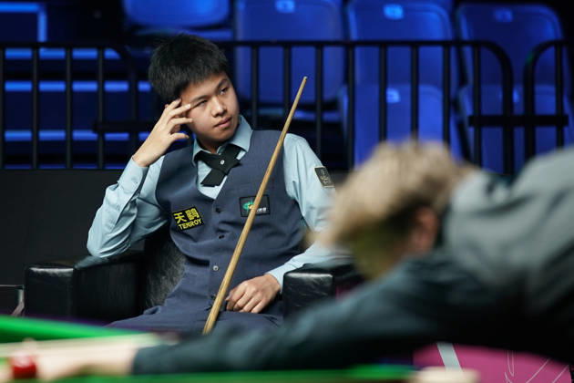 WUHAN, CHINA - AUGUST 23: Wang Xinzhong of China reacts in the first round match against Ben Mertens of Belgium on day 1 of Wuhan Open 2026 at the Optics Valley Gymnasium of Huazhong University of Science and Technology on August 23, 2026 in Wuhan, Hubei Province of China.  Copyright: xTaixChengzhex 111661617833