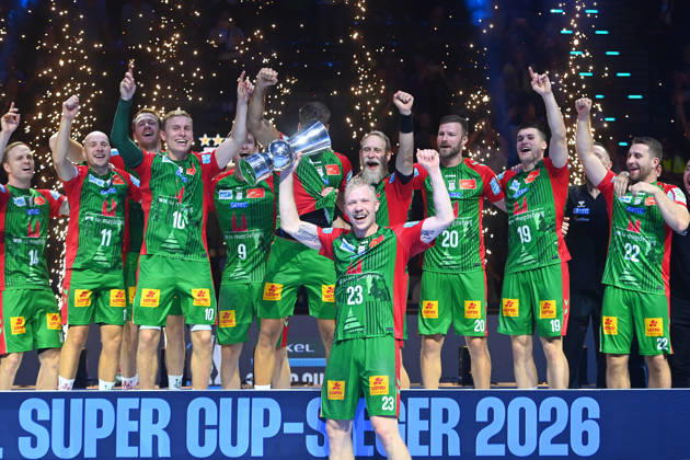 Awards Ceremony: Magnus SAUGSTRUP, SC Magdeburg, with trophy, cup, player, team photo, team, squad, team photo, celebration,joy, excitement, handball Rexel Super Cup 2026 Men’s Match: SC Magdeburg vs. Füchse Berlin 38–30 on August 22, 2026, at SAP GARDEN in Munich