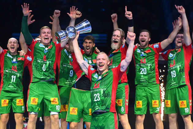 Awards Ceremony, Magnus SAUGSTRUP, SC Magdeburg with trophy, cup, award, players, team photo, team, squad, team photo, Celebration, Joy, Excitement, 2026 Rexel Super Cup Men’s Handball: SC Magdeburg vs. Füchse Berlin 38–30 on August 22, 2026, at SAP GARDEN in Munich