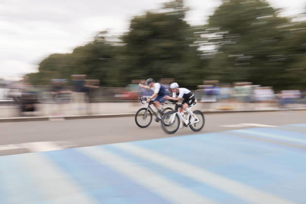 IRONMAN 70.3 Leipzig 2026 Cycling Segment, Sachsenbrücke: Athletes at the IRONMAN 70.3 Leipzig on August 23, 2026, during the cycling leg. The half-distance race consists of a 1.9-kilometer swim, a 90-kilometer bike ride, and a 21.1-kilometer run, and is part of the international IRONMAN 70.3 series