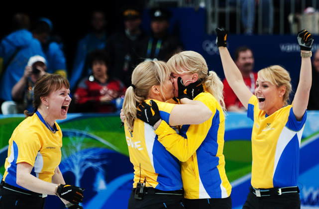 2010 Winter Olympics, Curling, Womens, Final, Canada vs. Sweden: Cathrine Lindahl, Anna Le Moine, and Eva Lund kissing Anette Norberg; Jubilation, Gold, Kiss; Vancouver, Canada  Copyright: xJoelxMarklundx
